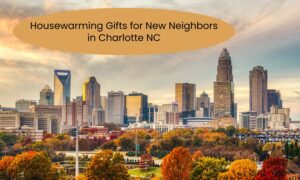 Charlotte skyline during fall with text reading “Housewarming Gifts for New Neighbors in Charlotte NC” above the image.