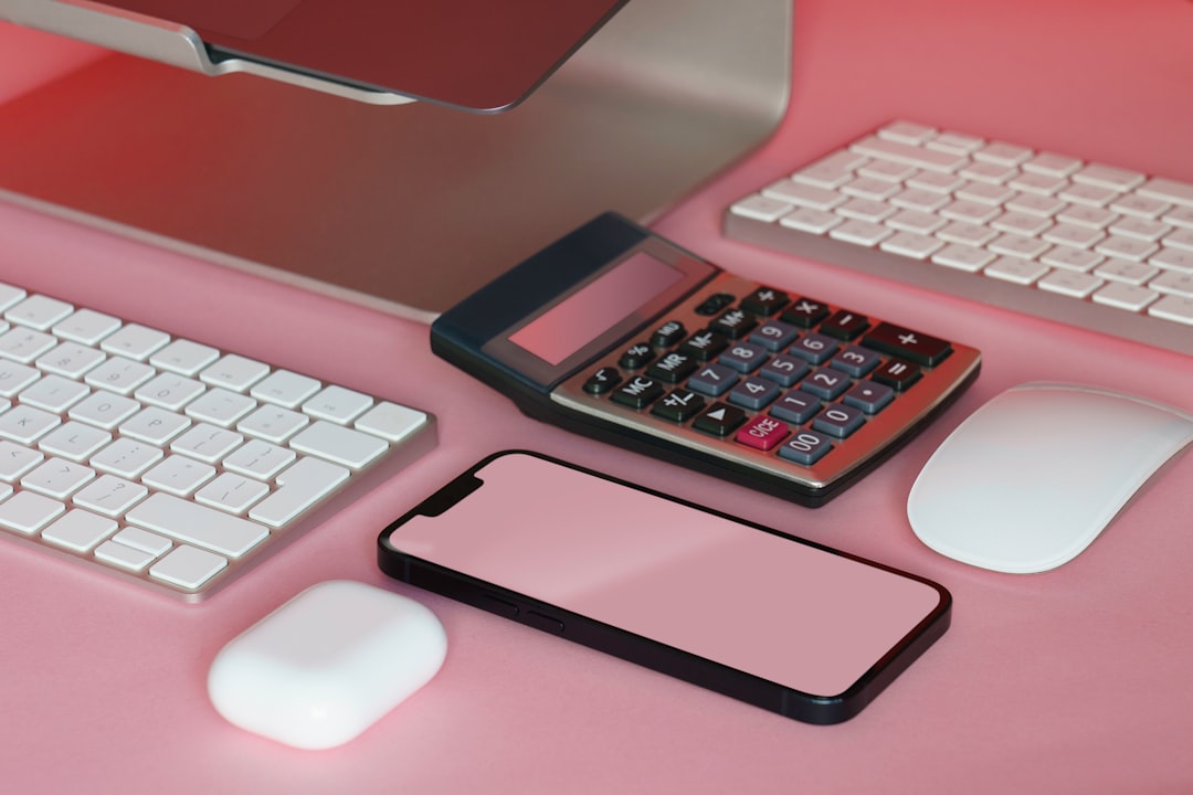 A minimalist and professional desk scene with house keys, a calculator, and a notepad, symbolizing the calculated strategy of correcting a home's price.