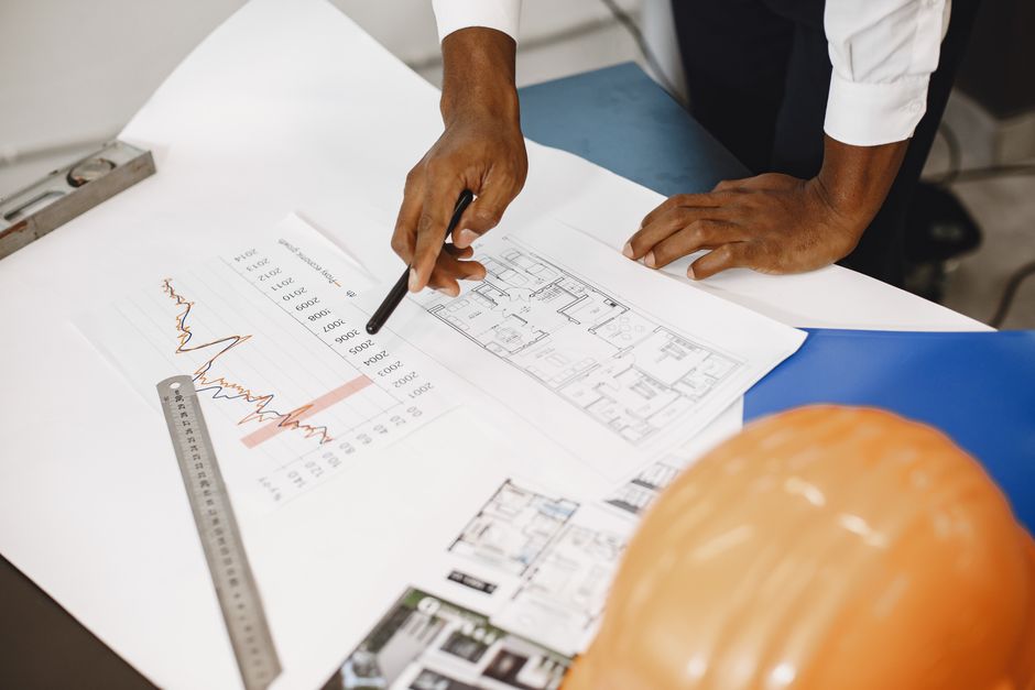 A close-up of hands signing a real estate contract, symbolizing the important financial decisions Charlotte buyers make regarding commissions and agreements.