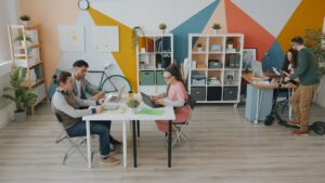 Professional solo real estate agent attentively consults with a couple in a bright, modern office, symbolizing a personali...